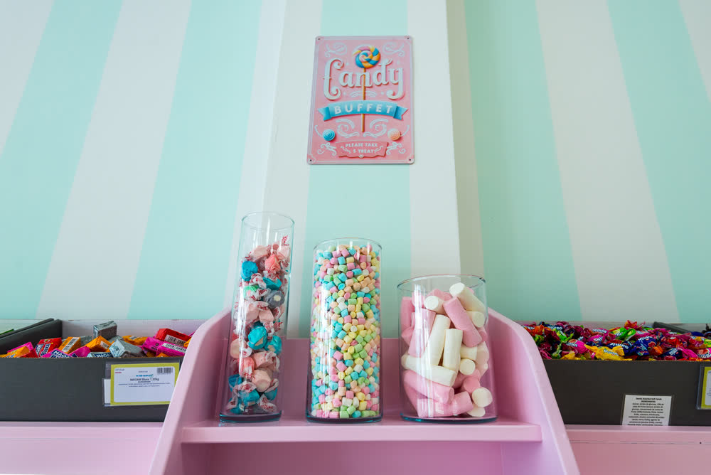 Candy buffet jars filled with soft sweets and marshmallows
